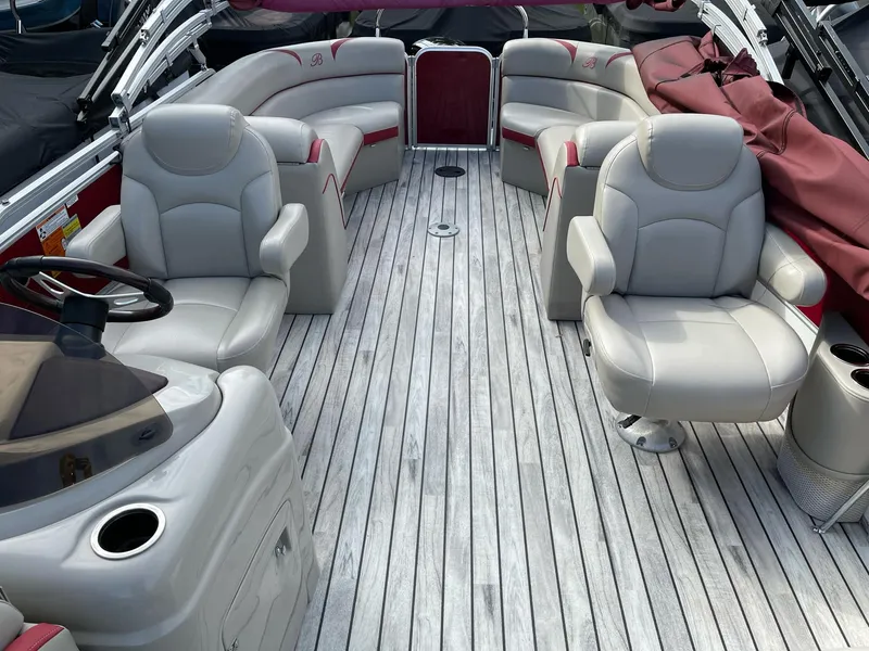 Slide: The Image of 2016 Berkshire 233RFX STS boat interior with plush seating and sleek design. - 9
