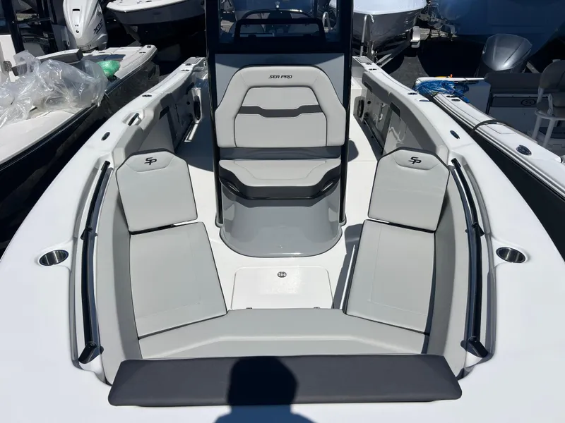 Slide: The Image of 2025 Sea Pro 245 FLX boat interior with sleek seating and modern design. - 15
