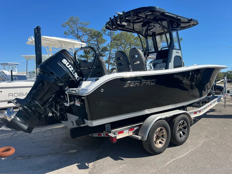 Slide: The Image of 2025 Sea Pro 245 FLX boat on trailer with Suzuki outboard motor. - 6