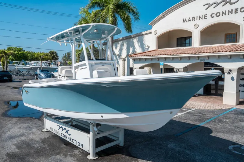 Slide: The Image of 2025 Sea Hunt Ultra 229 boat displayed at Marine Connection dealership. - 8