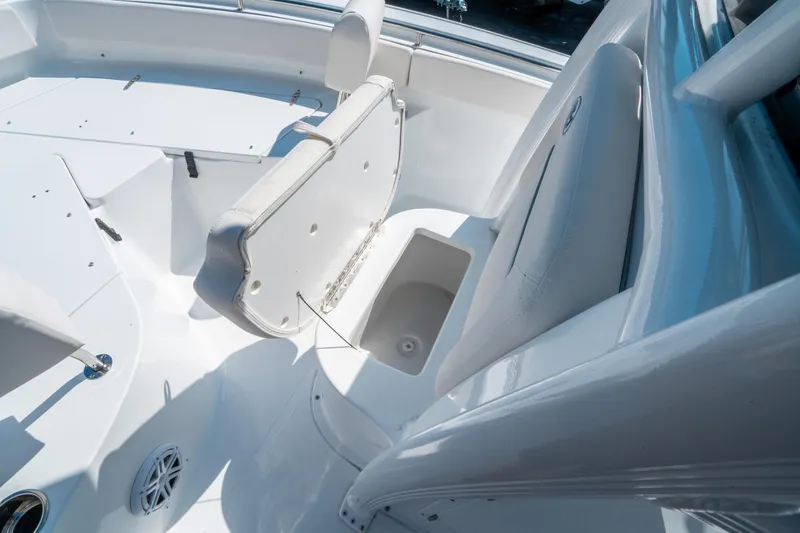 Slide: The Image of 2025 Sea Hunt Ultra 229 boat interior with seating and storage compartments. - 25