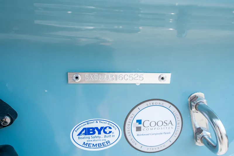 Slide: The Image of 2025 Sea Hunt Ultra 229 boat identification plate with ABYC and Coosa Composites logos. - 28