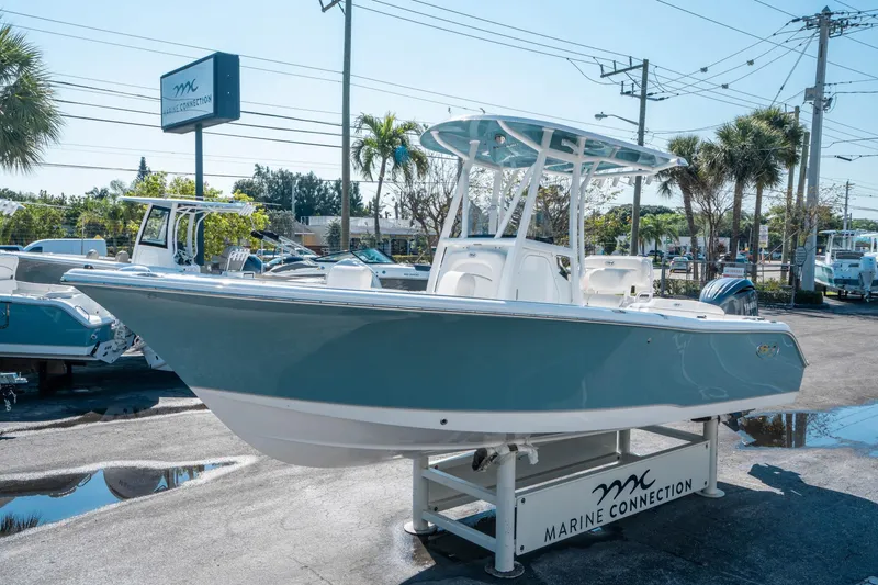 Slide: The Image of 2025 Sea Hunt Ultra 229 boat displayed at Marine Connection dealership. - 6