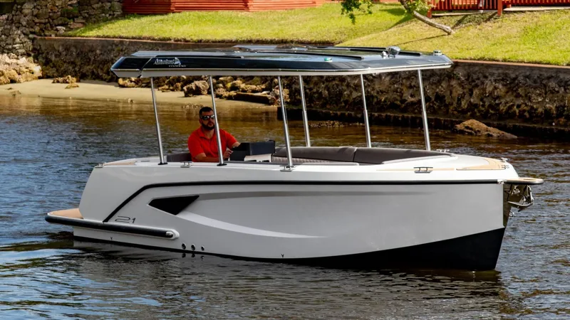 Slide: The Image of 2023 Alfastreet 21 Open boat cruising on a calm river with a canopy. - 1