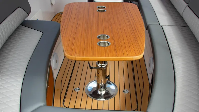 Slide: The Image of 2023 Alfastreet 21 Open boat interior with wooden table and cushioned seating. - 10
