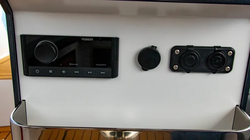 Slide: The Image of Control panel of 2023 Alfastreet 21 Open boat with audio system and power outlets. - 17