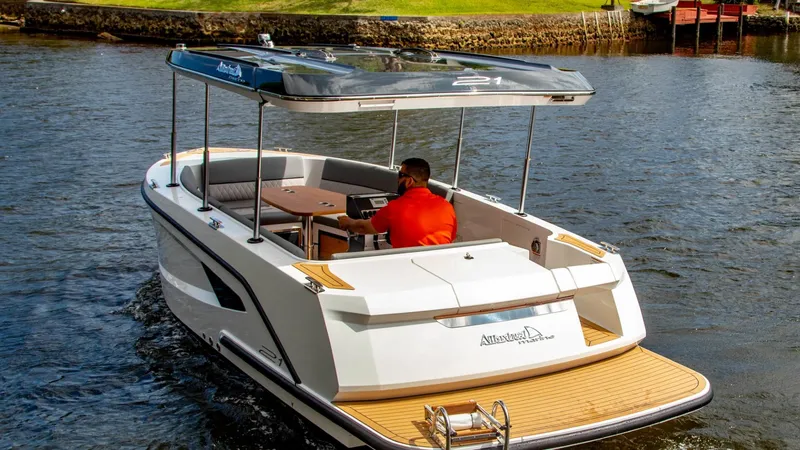 Slide: The Image of 2023 Alfastreet 21 Open boat cruising on a calm river with a canopy. - 3