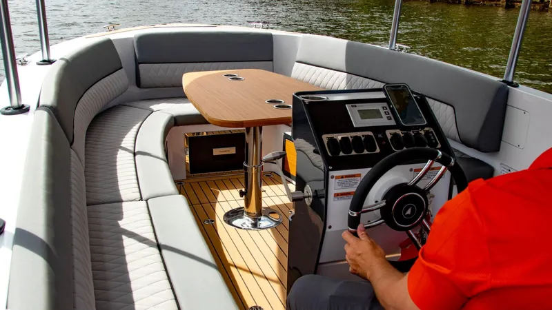 Slide: The Image of 2023 Alfastreet 21 Open boat interior with steering wheel and seating area. - 30