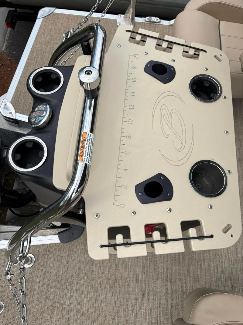 Slide: The Image of 2021 Barletta C22CC boat console with cup holders and ruler. - 13