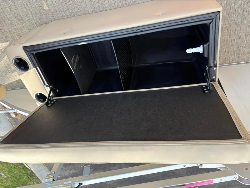 Slide: The Image of Open storage compartment in a 2021 Barletta C22CC boat, showcasing interior space. - 8