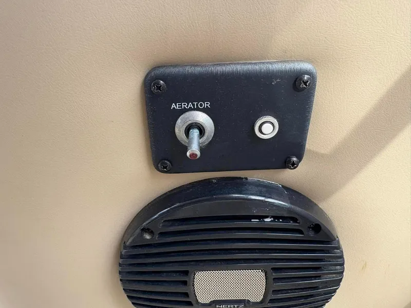 Slide: The Image of Aerator switch and speaker on 2021 Barletta C22CC boat. - 9