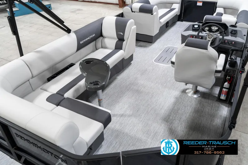Slide: The Image of 2025 Bennington 21 SL pontoon boat interior with plush seating and modern design. - 14