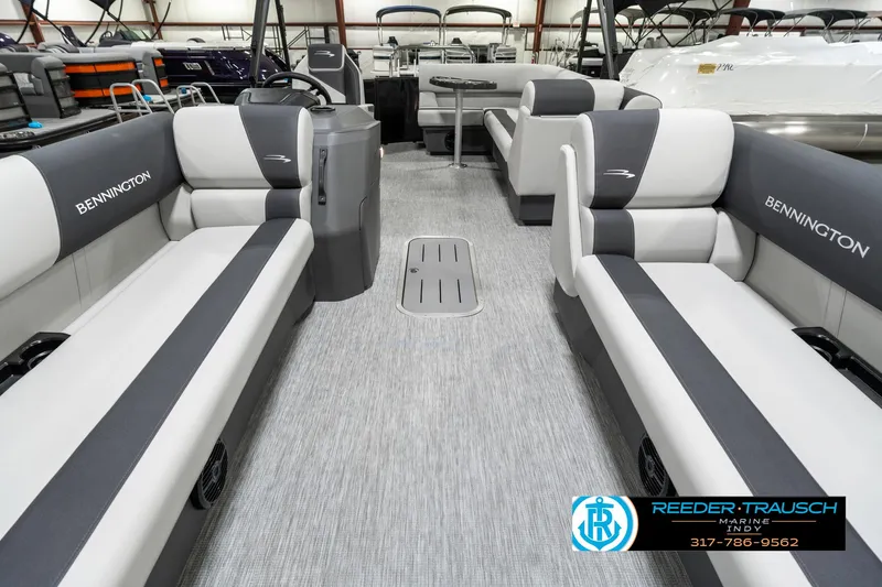 Slide: The Image of 2025 Bennington 21 SL pontoon boat interior with gray and white seating. - 16