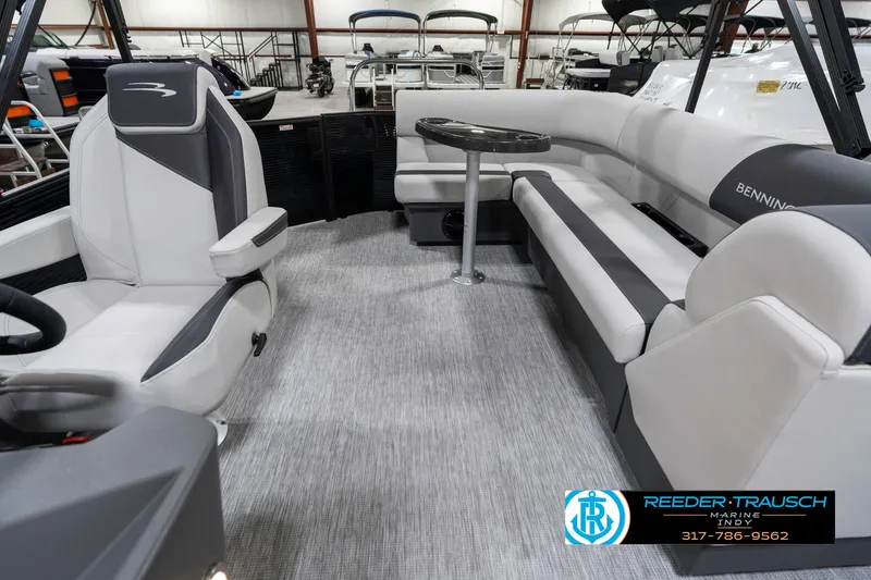 Slide: The Image of 2025 Bennington 21 SL boat interior with modern seating and table setup. - 17