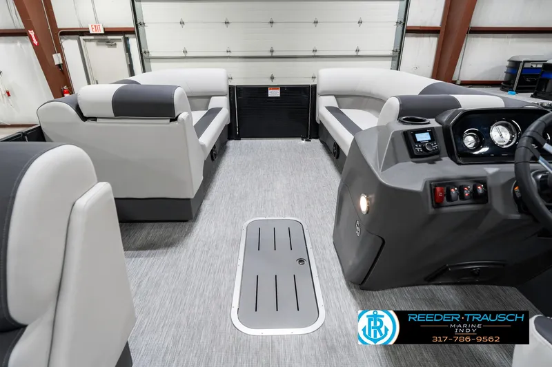 Slide: The Image of 2025 Bennington 21 SL pontoon boat interior with modern seating and control panel. - 20