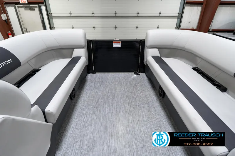 Slide: The Image of Interior of 2025 Bennington 21 SL pontoon boat with gray seating and flooring. - 21