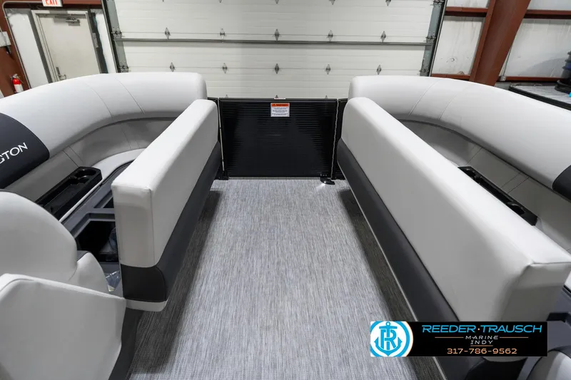 Slide: The Image of 2025 Bennington 21 SL pontoon boat interior with gray seating and flooring. - 22