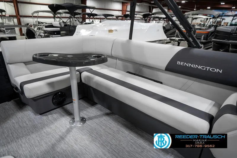 Slide: The Image of 2025 Bennington 21 SL pontoon boat interior with gray seating and table. - 25
