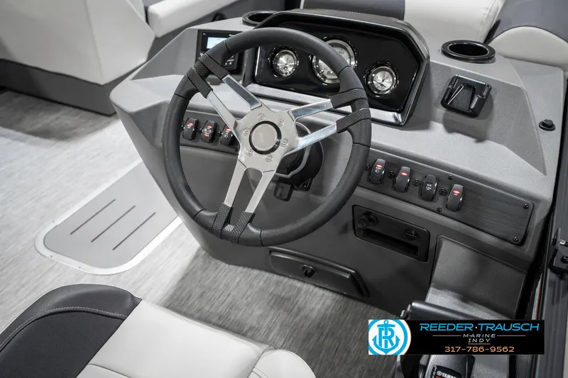 Slide: The Image of 2025 Bennington 21 SL boat dashboard with steering wheel and control panel. - 30