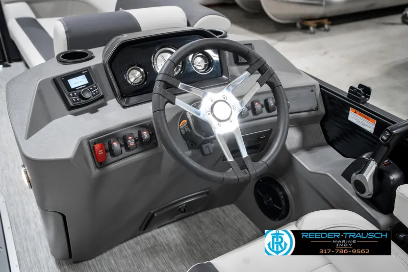 Slide: The Image of 2025 Bennington 21 SL boat dashboard with steering wheel and control panel. - 31