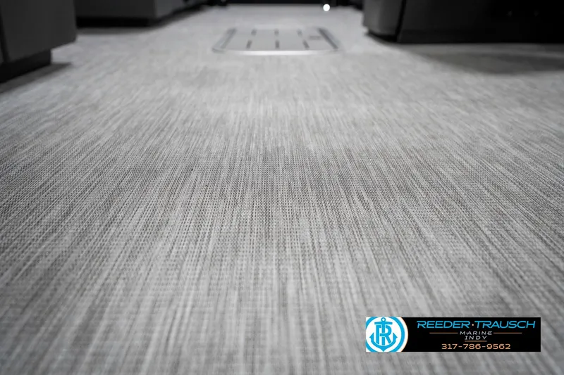 Slide: The Image of 2025 Bennington 21 SL boat interior flooring, featuring a textured gray surface. - 46