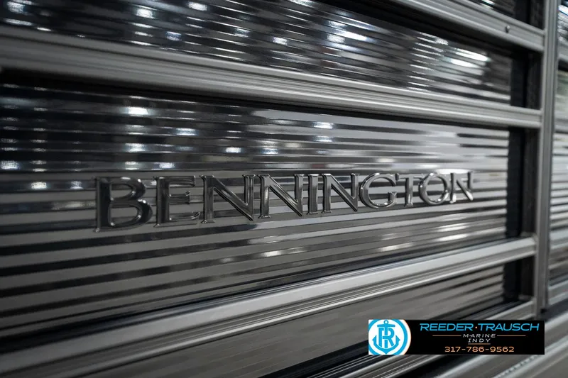 Slide: The Image of 2025 Bennington 21 SL boat with metallic finish and logo detail. - 48