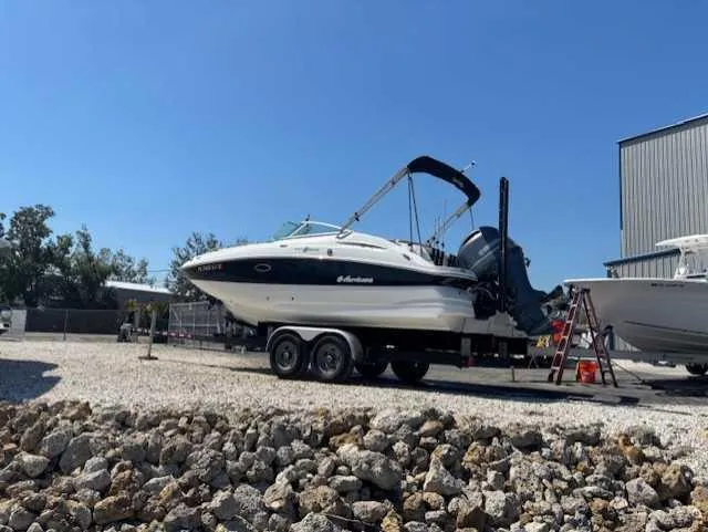 Slide: The Image of 2015 Hurricane SD 2200 DC OB boat on trailer in outdoor storage area. - 10