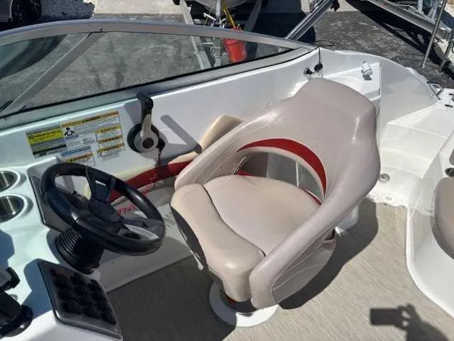 Slide: The Image of 2015 Hurricane SD 2200 DC OB boat cockpit with steering wheel and captain's chair. - 16