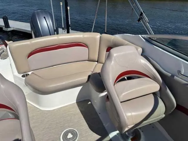 Slide: The Image of 2015 Hurricane SD 2200 DC OB boat interior with beige and red seating. - 17