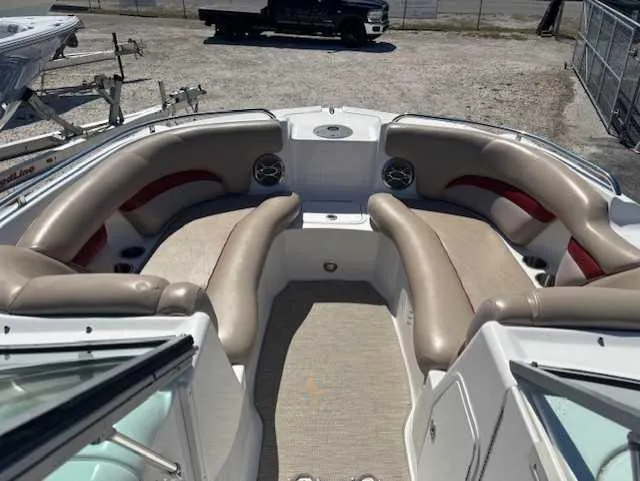 Slide: The Image of 2015 Hurricane SD 2200 DC OB boat interior with beige seating and carpeted floor. - 18