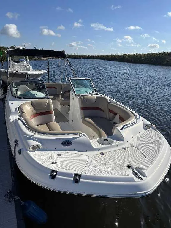 Slide: The Image of 2015 Hurricane SD 2200 DC OB boat docked on a sunny day by the water. - 20