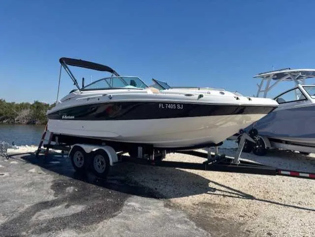 Slide: The Image of 2015 Hurricane SD 2200 DC OB boat on trailer by water, sunny day. - 4