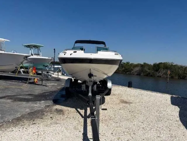 Slide: The Image of 2015 Hurricane SD 2200 DC OB boat on trailer by waterfront. - 5