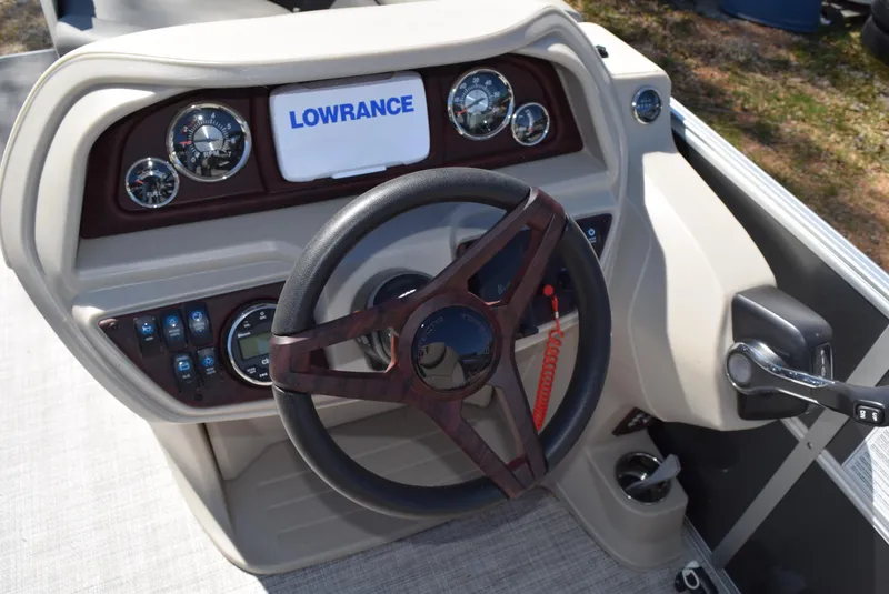 Slide: The Image of Steering console of 2023 Trifecta 22RF LE 2.75 with Lowrance display and gauges. - 10