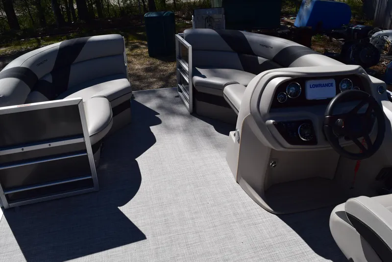 Slide: The Image of 2023 Trifecta 22RF LE 2.75 pontoon boat interior with seating and steering console. - 9