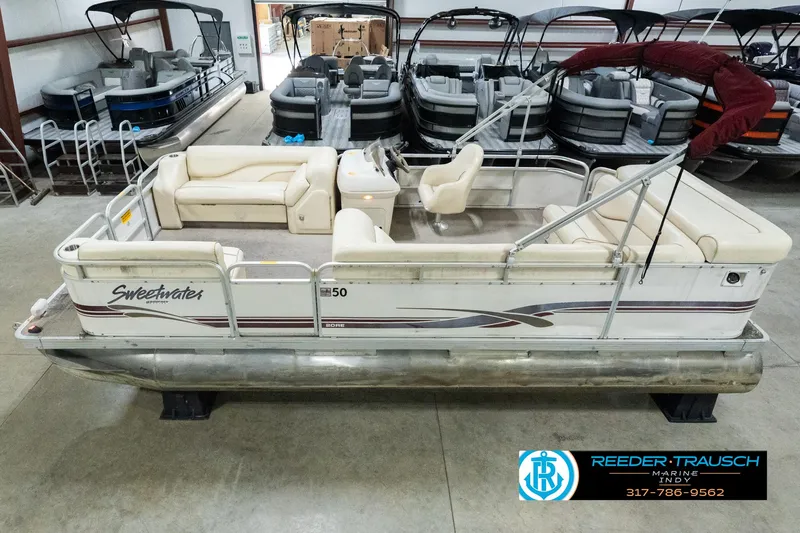 Slide: The Image of 2001 Sweetwater SW 20 RE pontoon boat in showroom, side view. - 1