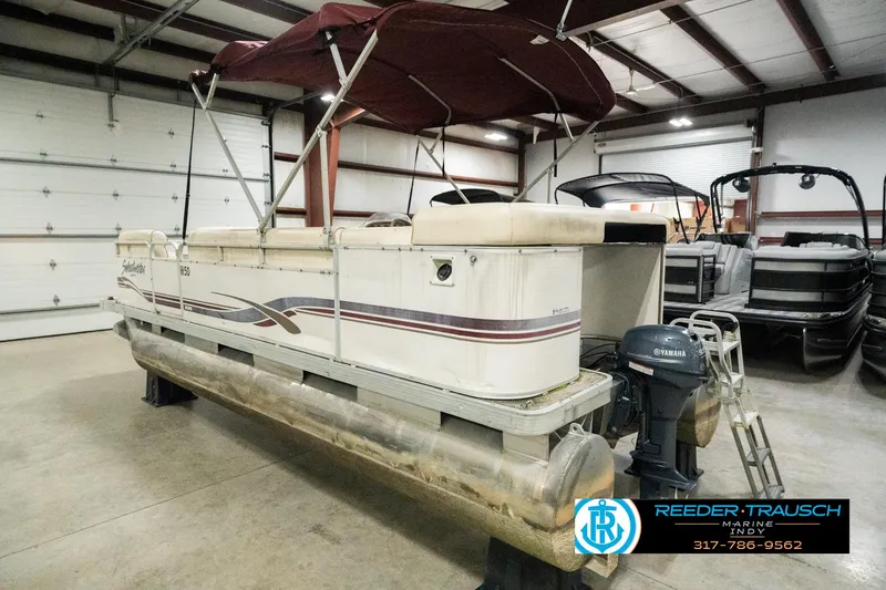 Slide: The Image of 2001 Sweetwater SW 20 RE pontoon boat in indoor storage facility. - 10