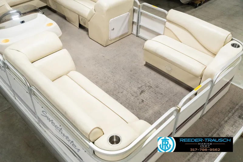 Slide: The Image of 2001 Sweetwater SW 20 RE pontoon boat with beige seating and spacious deck layout. - 13