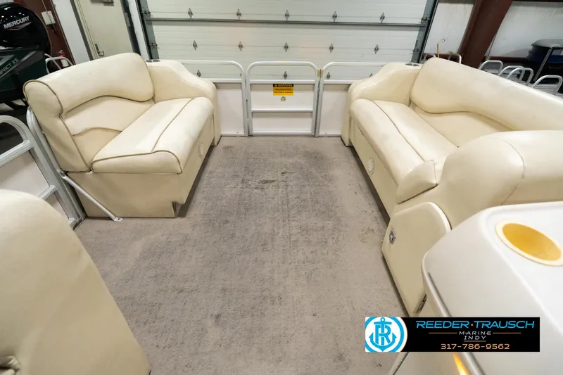 Slide: The Image of 2001 Sweetwater SW 20 RE pontoon boat interior with beige seating. - 20