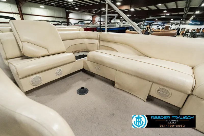 Slide: The Image of Interior of a 2001 Sweetwater SW 20 RE pontoon boat with beige seating. - 23