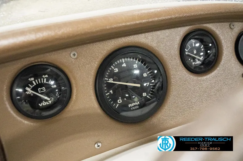Slide: The Image of Dashboard of a 2001 Sweetwater SW 20 RE boat with RPM, volt, and fuel gauges. - 29