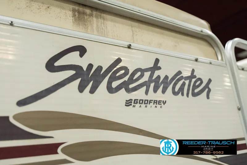 Slide: The Image of 2001 Sweetwater SW 20 RE boat by Godfrey Marine, side view with logo. - 40