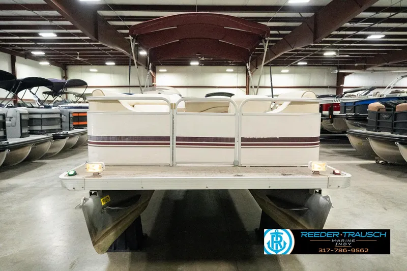 Slide: The Image of Sweetwater SW 20 RE pontoon boat, 2001 model, displayed indoors at Reeder-Trausch Marine. - 5