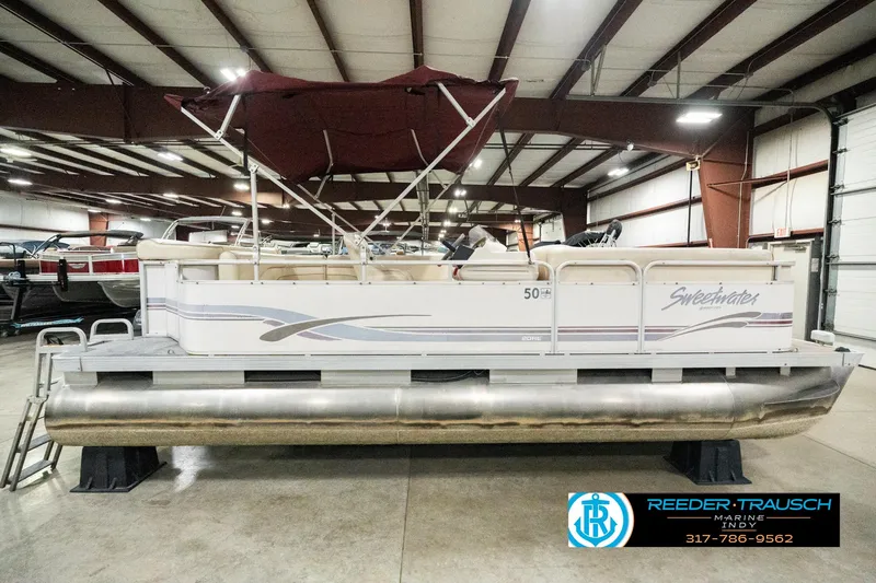 Slide: The Image of 2001 Sweetwater SW 20 RE pontoon boat in indoor storage facility. - 7