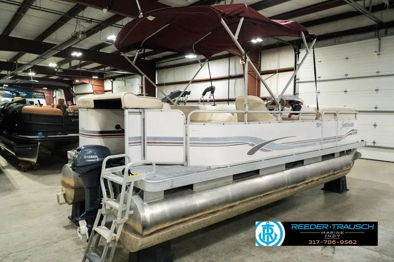 Slide: The Image of 2001 Sweetwater SW 20 RE pontoon boat in indoor storage facility. - 8