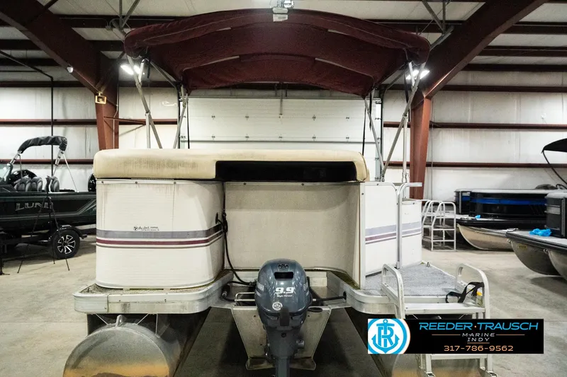 Slide: The Image of 2001 Sweetwater SW 20 RE pontoon boat in indoor storage facility. - 9
