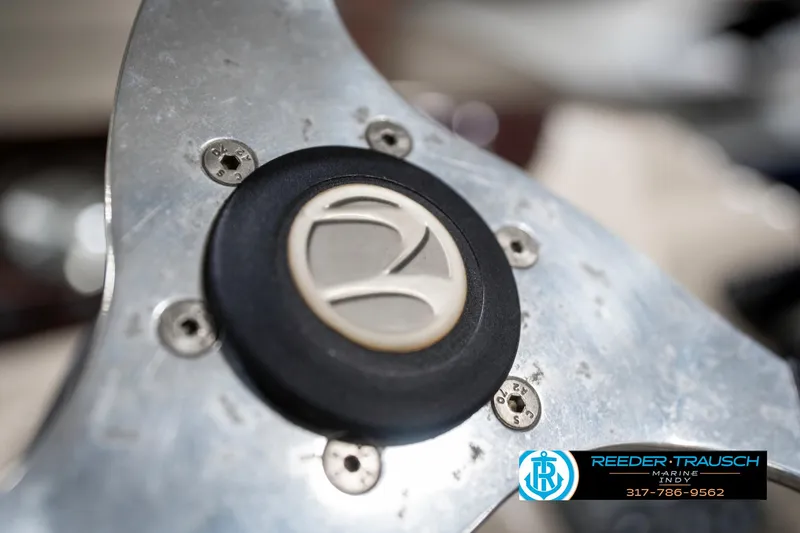 Slide: The Image of Steering wheel of a 2011 Bennington 17 Sli boat, featuring a metallic finish. - 29