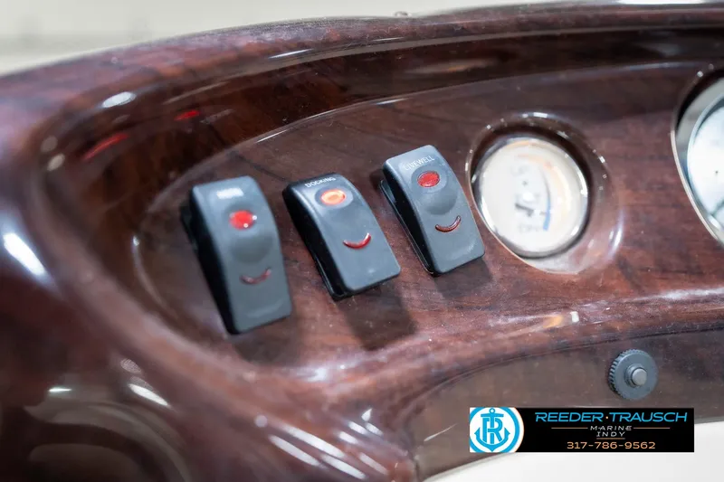 Slide: The Image of Dashboard of 2011 Bennington 17 Sli with switches and gauge. - 31