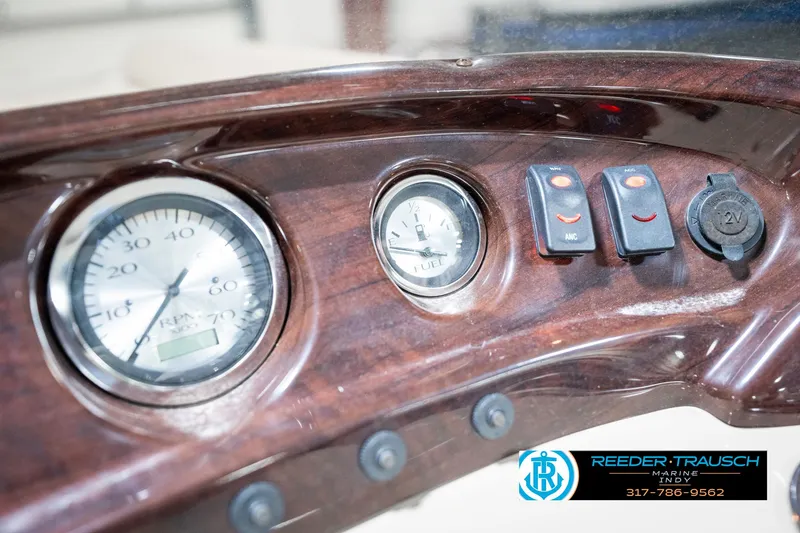Slide: The Image of Dashboard of 2011 Bennington 17 Sli boat with gauges and switches. - 32