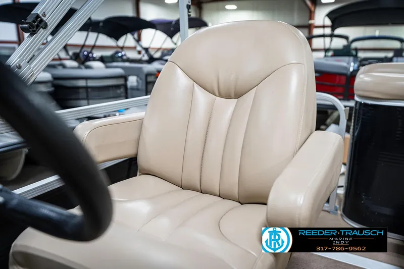 Slide: The Image of Beige captain's chair on a 2011 Bennington 17 Sli boat, showroom setting. - 35